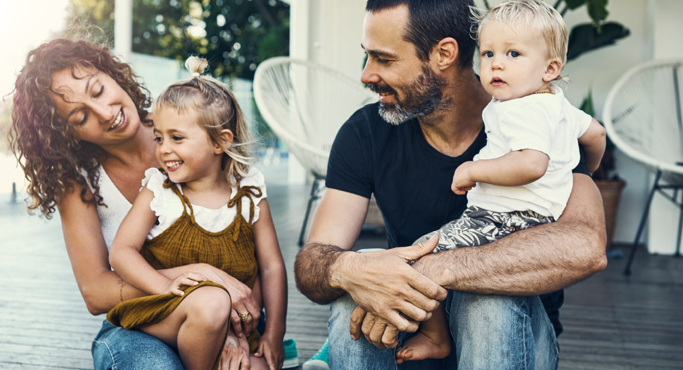A happy family on their porch