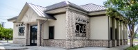 Brown and white brick building.