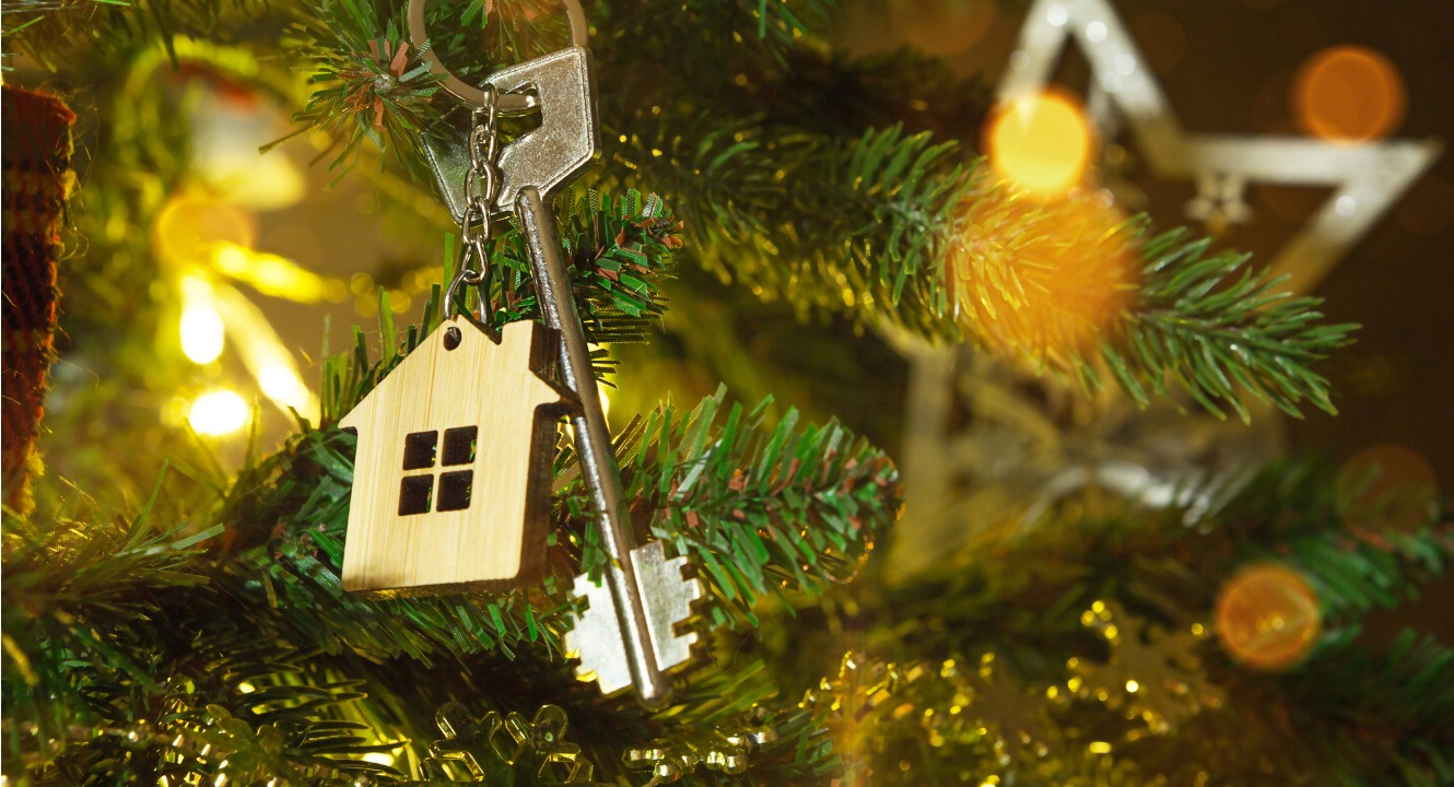 House key hanging on a Christmas tree like an ornament