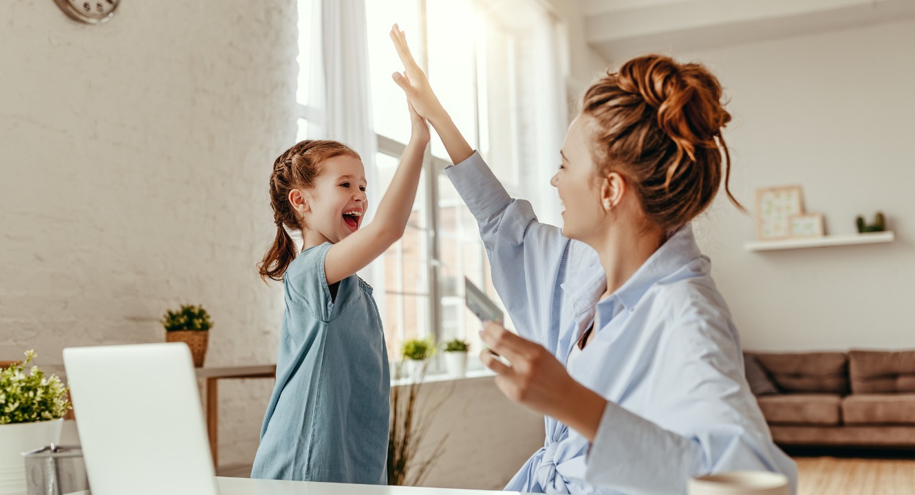 happy-woman-giving-high-five-to-small-girl-after-successful-purchase-on-internet